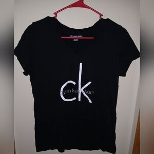 Clothes: Calvin Klein T-shirt (Large)